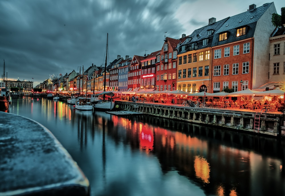 a river with a bunch of buildings next to it