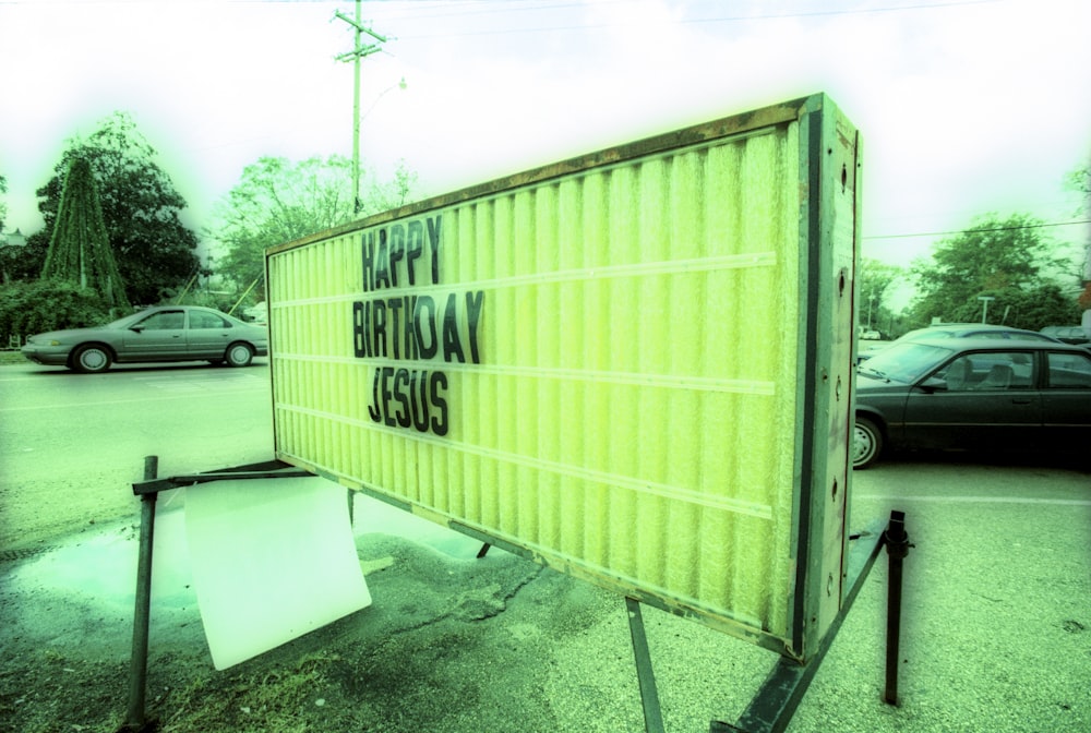 a happy birthday sign in a parking lot