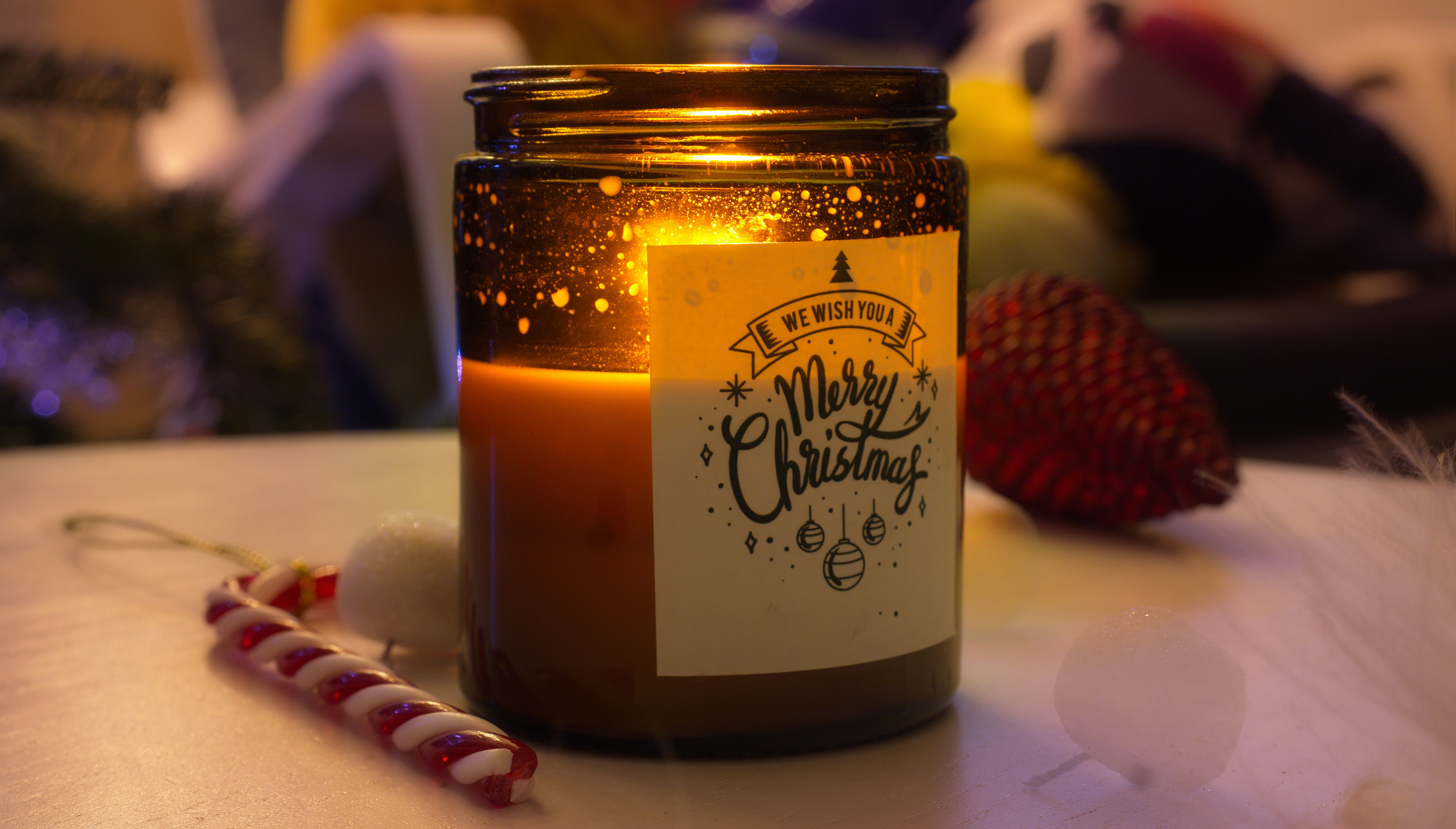 a lit candle sitting on top of a table