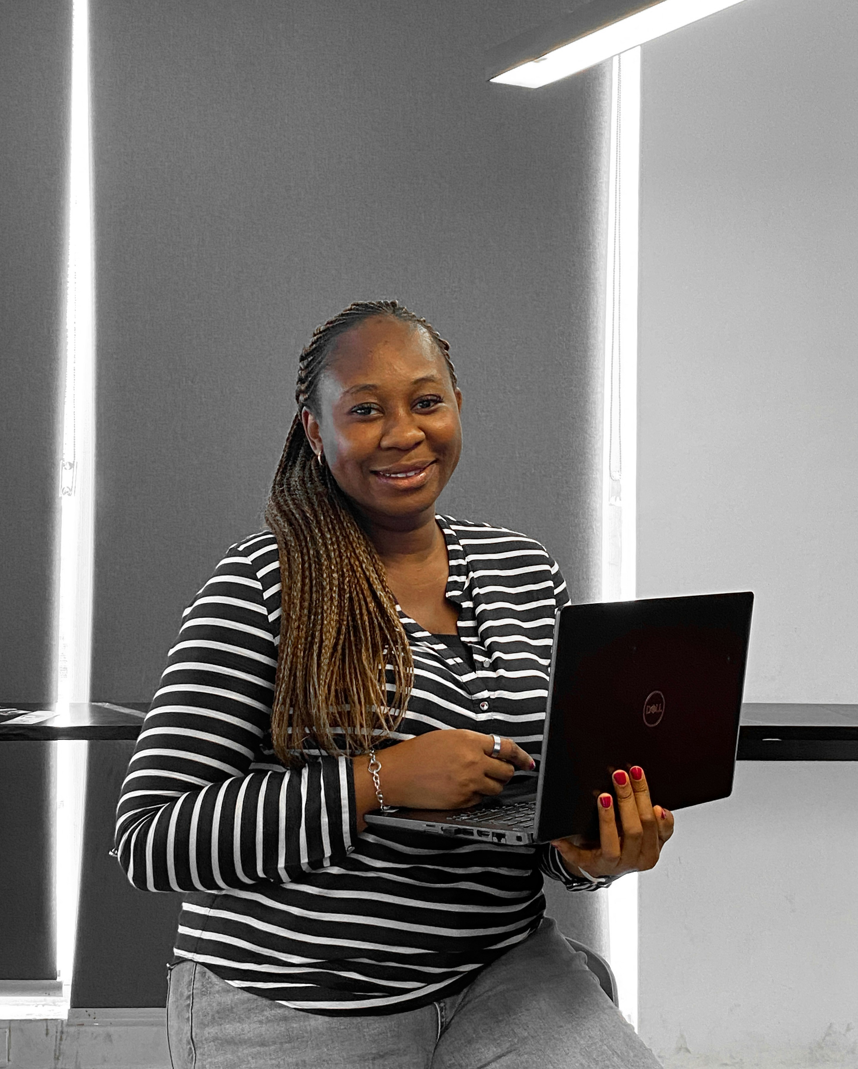 Professional woman with warm smile in modern office setting