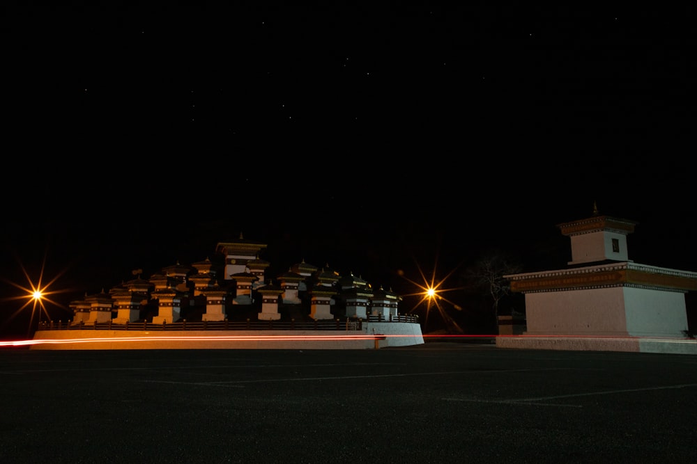 a large building with a clock tower at night