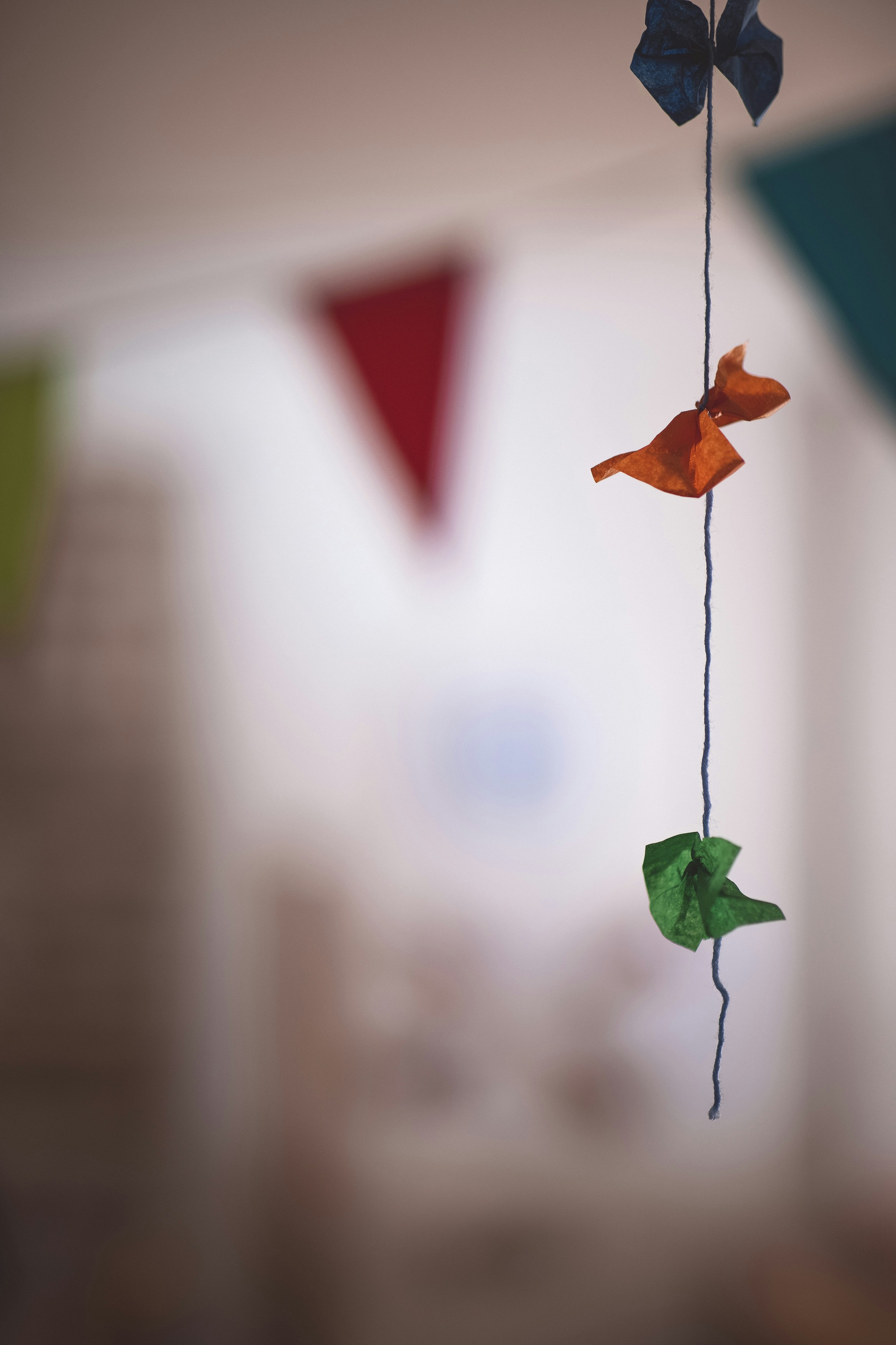 a close up of a wind chime hanging from a ceiling