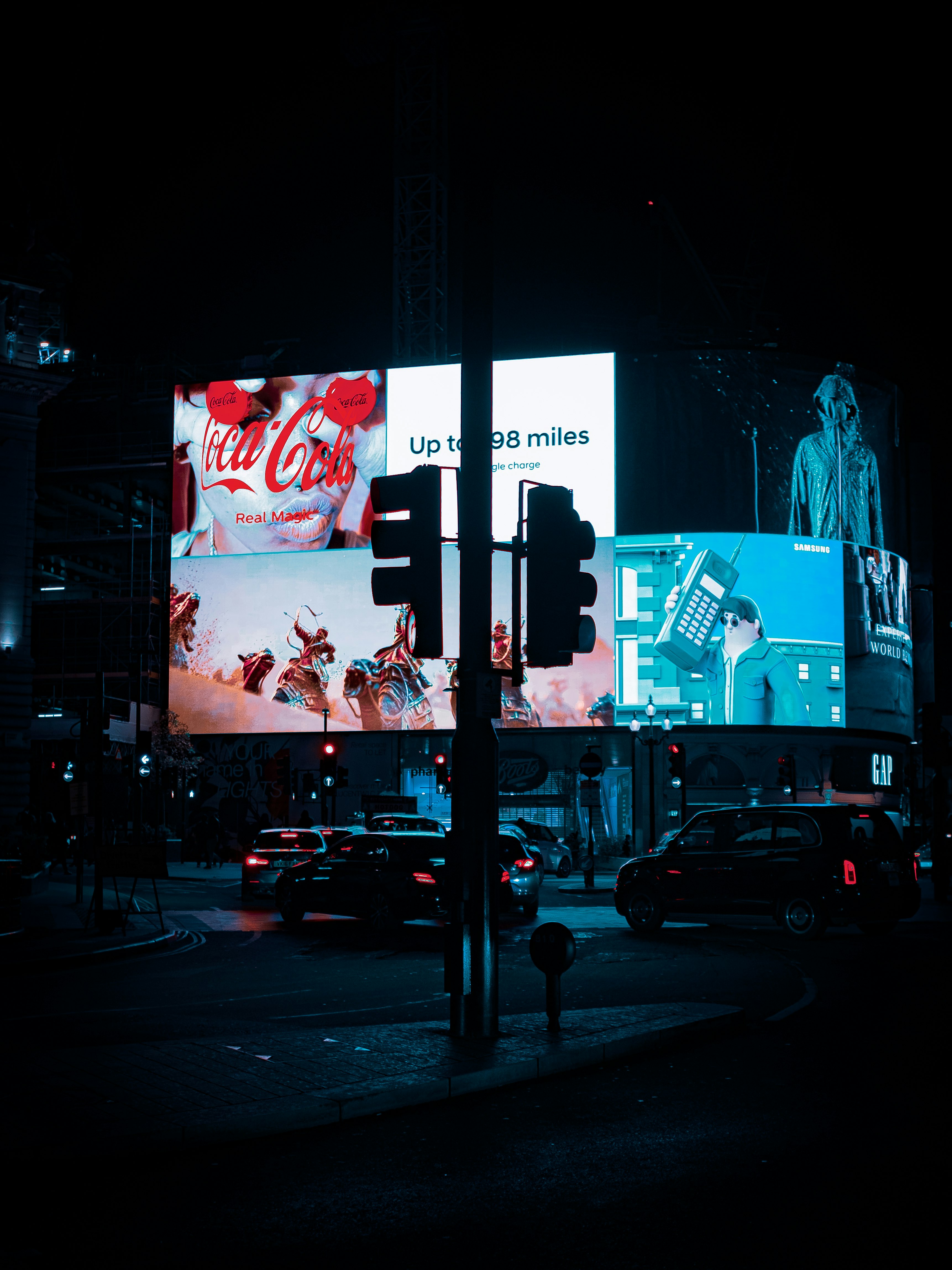 Advertisement display by night in London