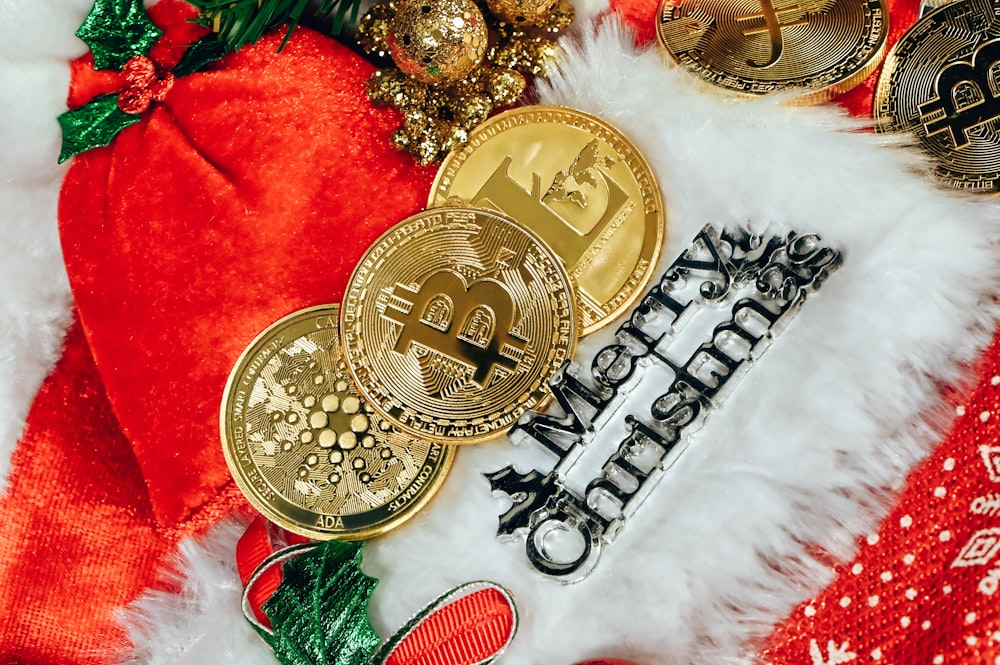 a pile of bitcoins sitting on top of a pile of christmas decorations