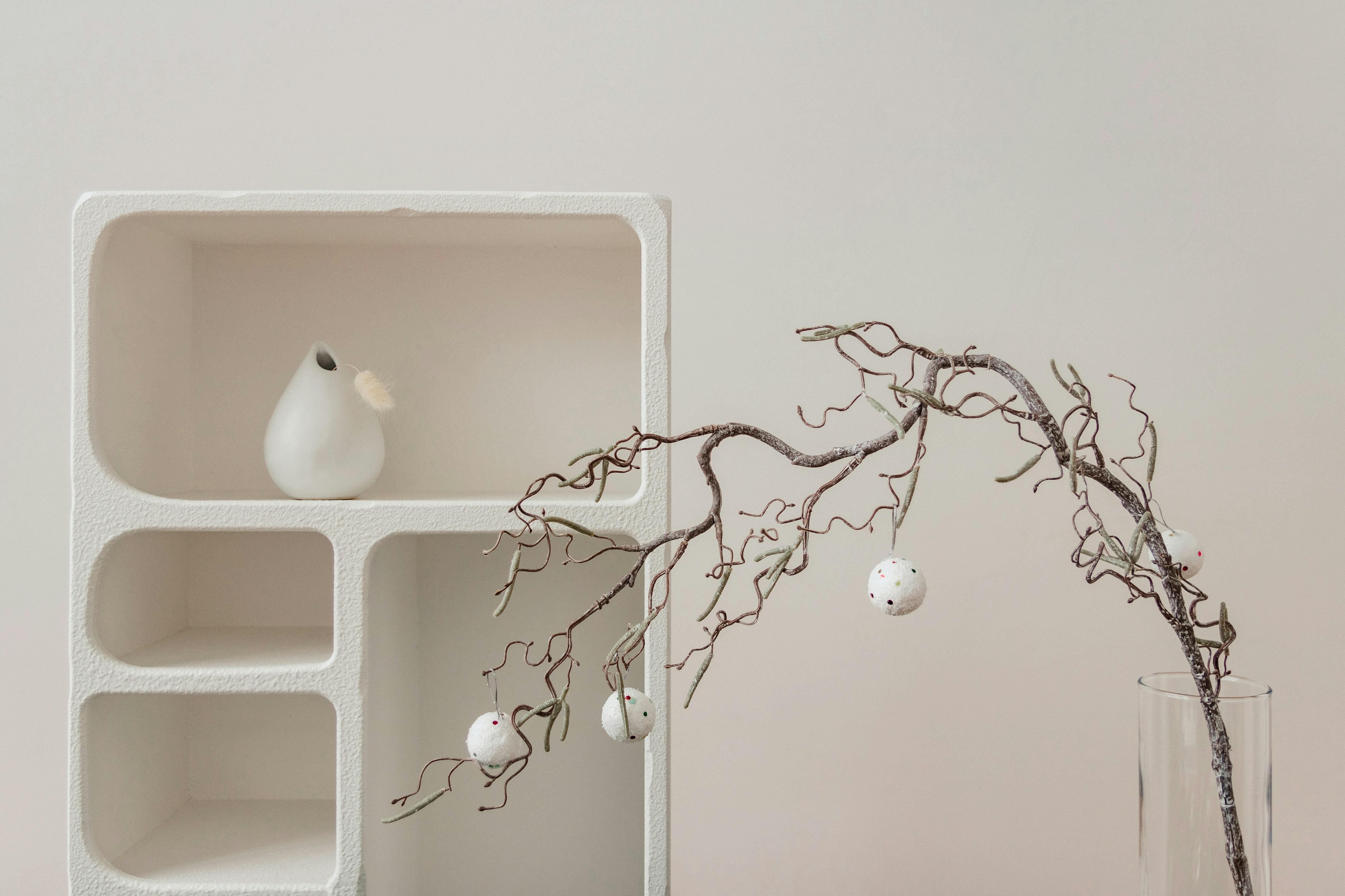 Storage shelf with dried tree branches.