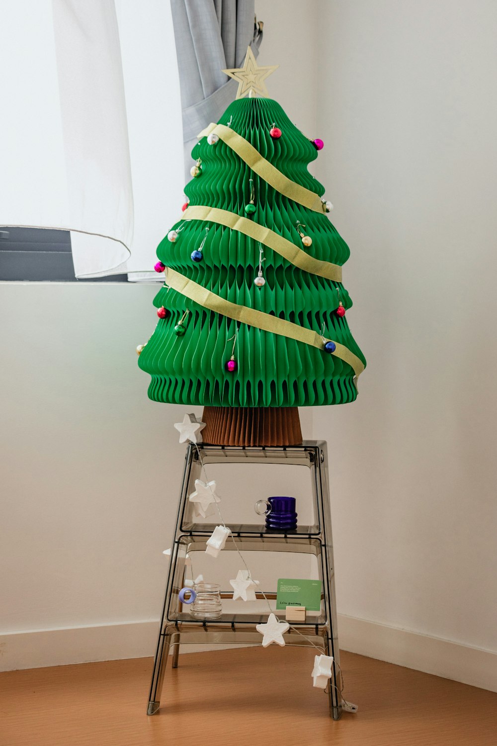 a christmas tree made out of green paper