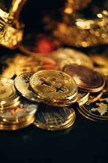a pile of gold coins sitting on top of a table
