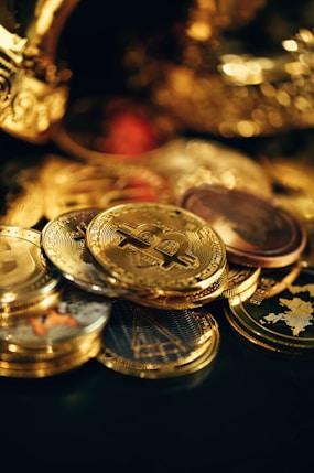 a pile of gold coins sitting on top of a table