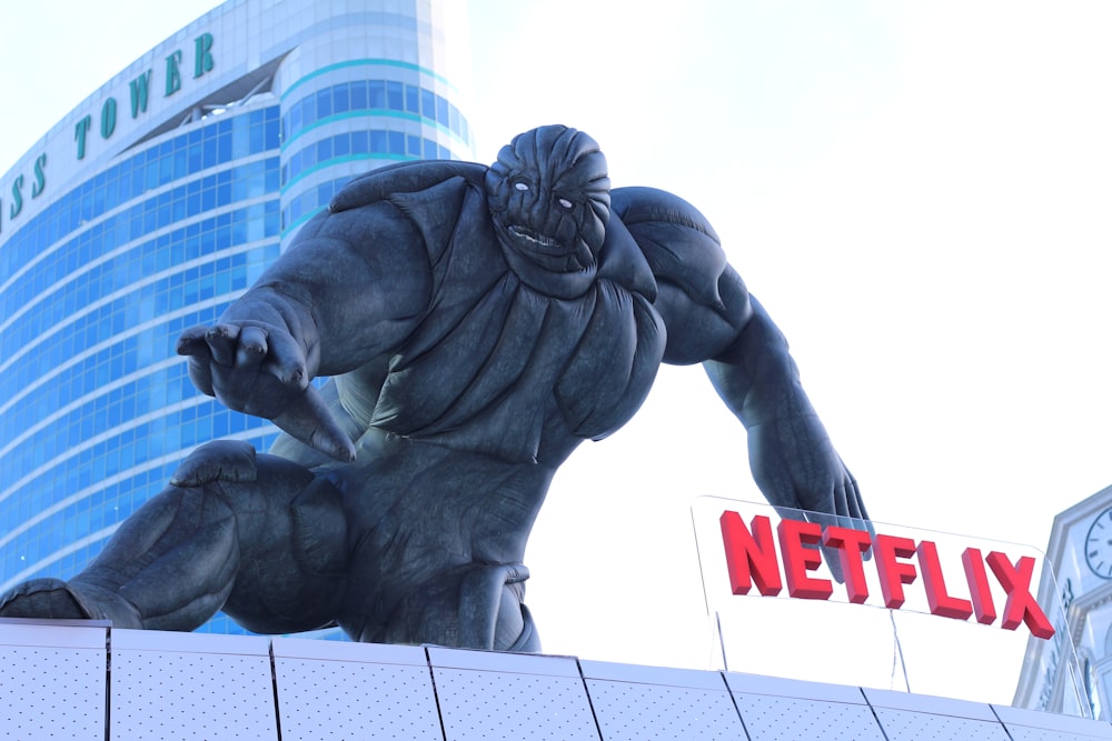a large statue of a gorilla on top of a building