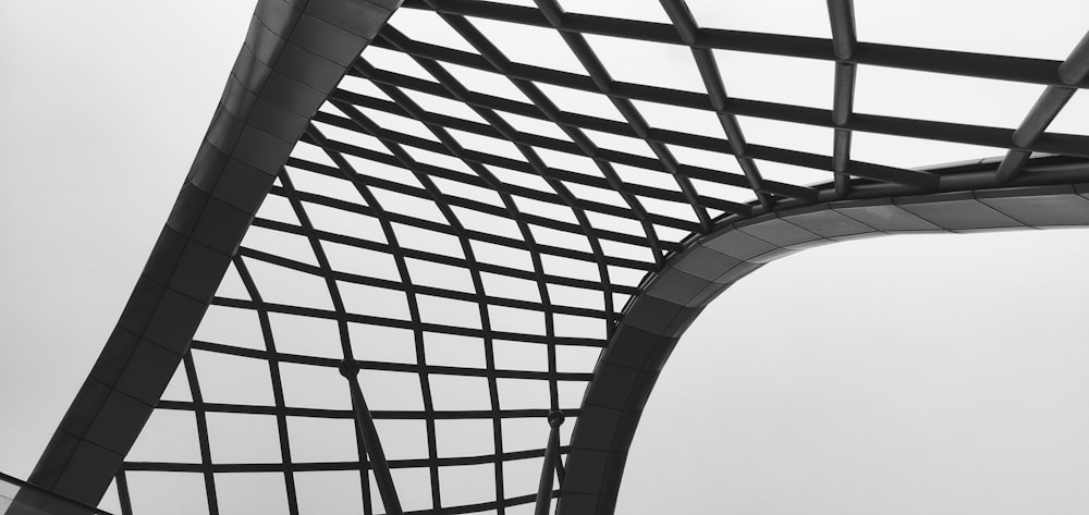 a black and white photo of a metal structure