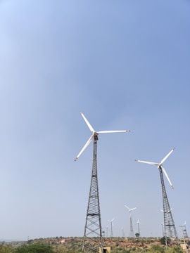A wind farm with several turbines spinning in the breeze.