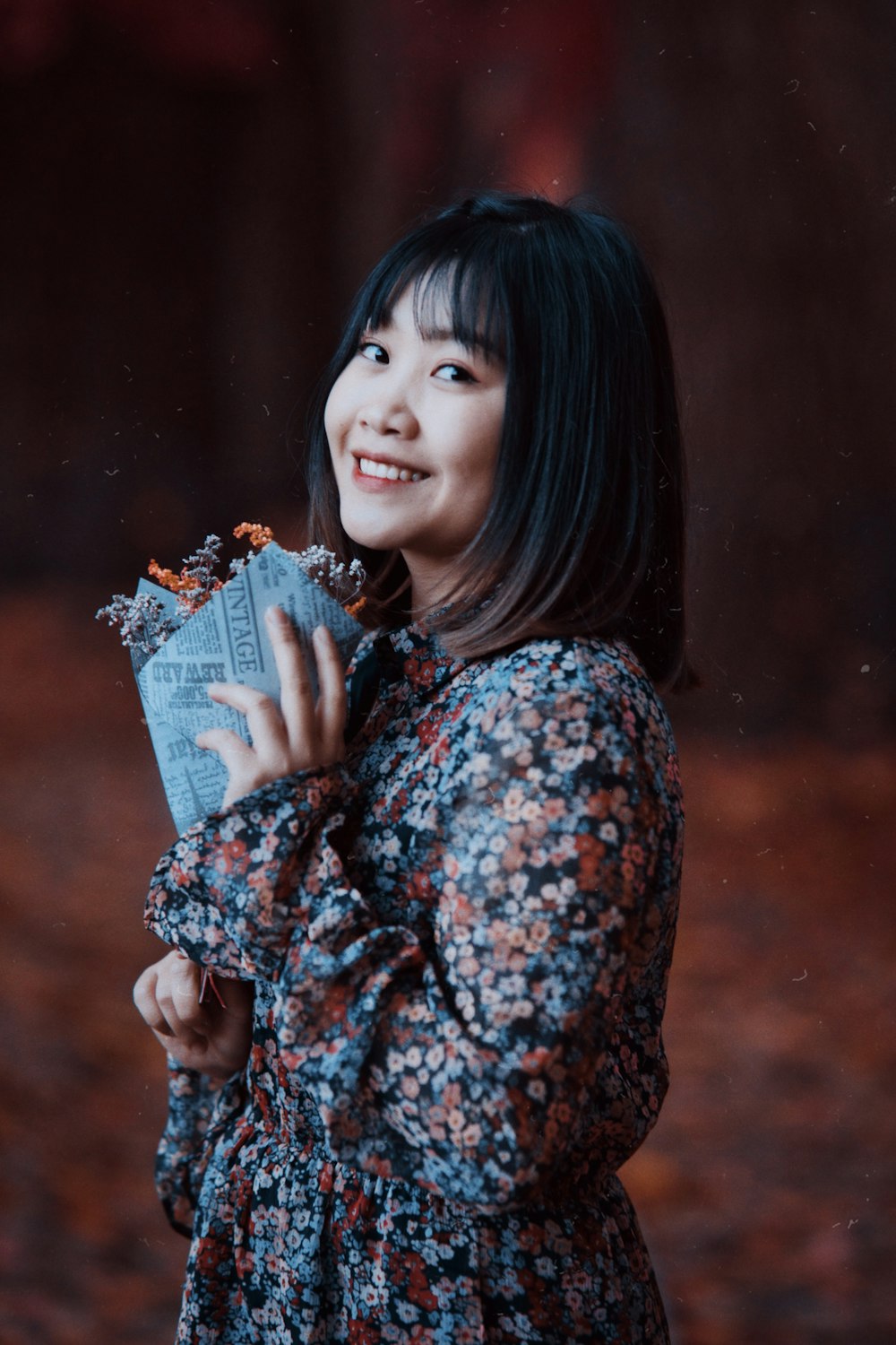 a woman is holding a bag of food in her hands