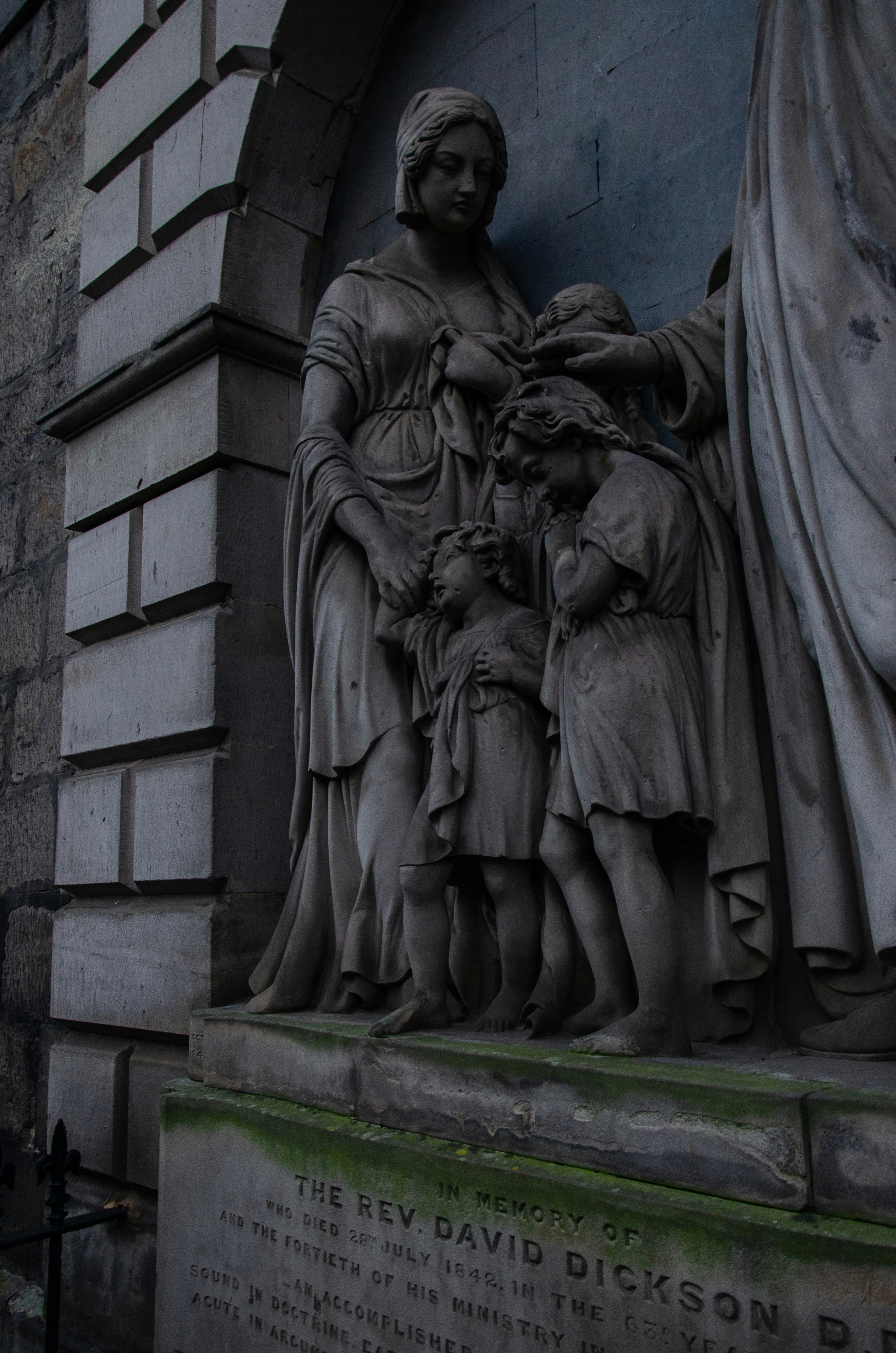 a statue of a woman holding a child