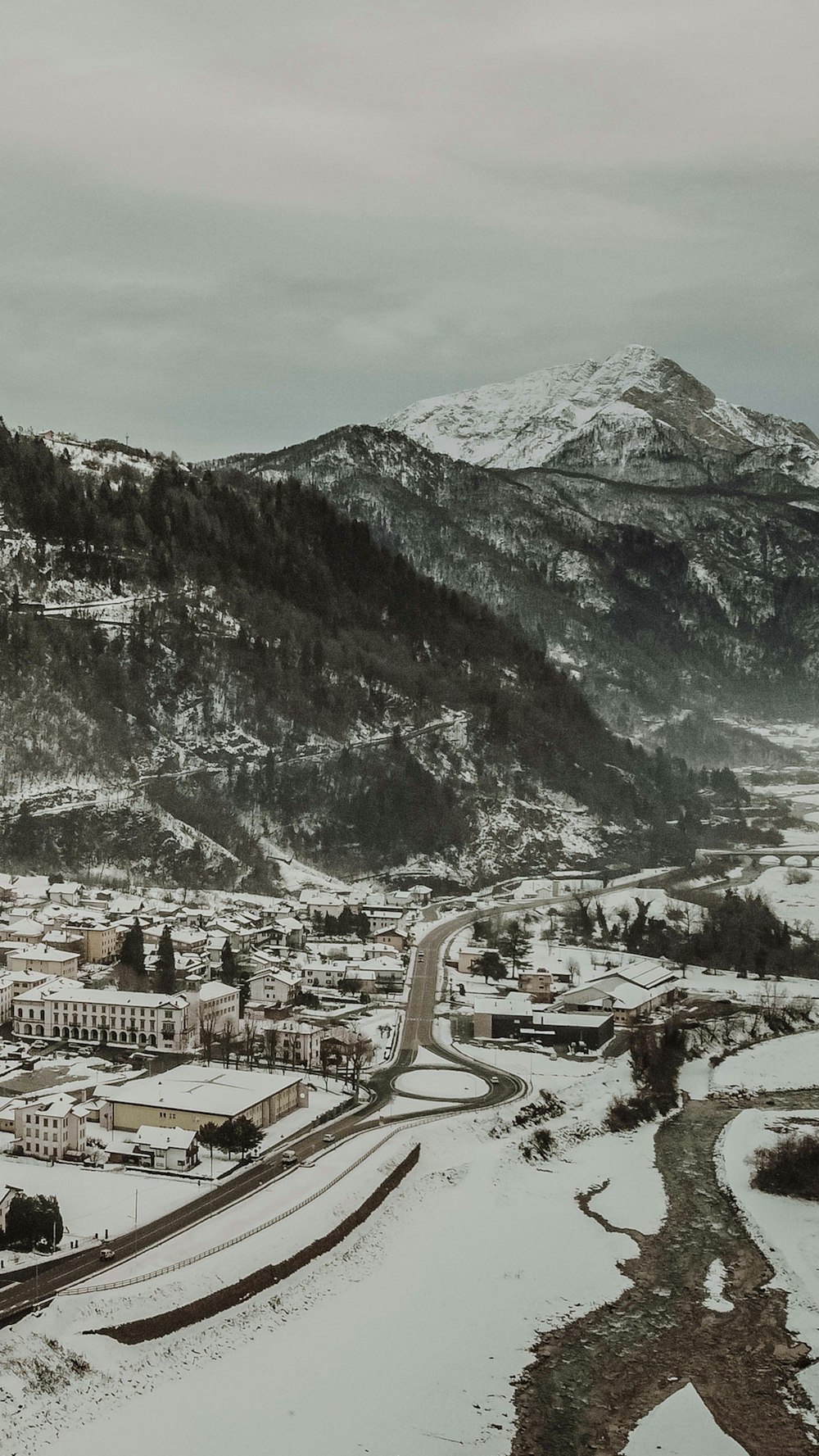 a snowy landscape with a mountain in the background