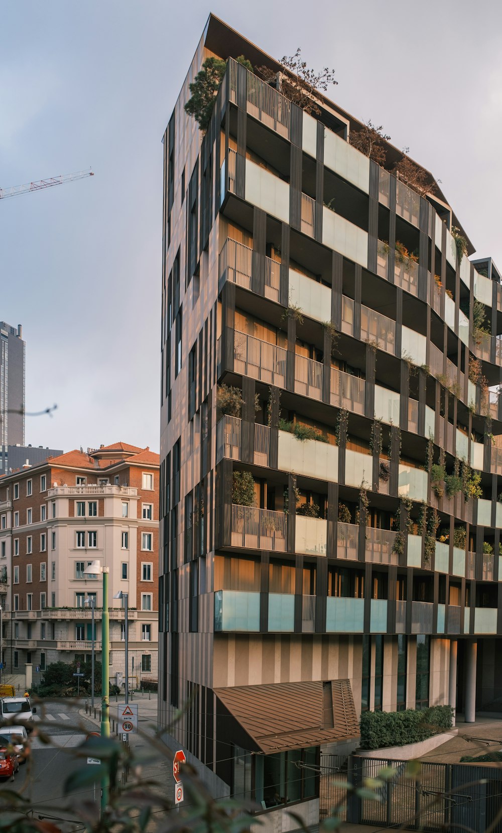 a tall building with lots of balconies on top of it