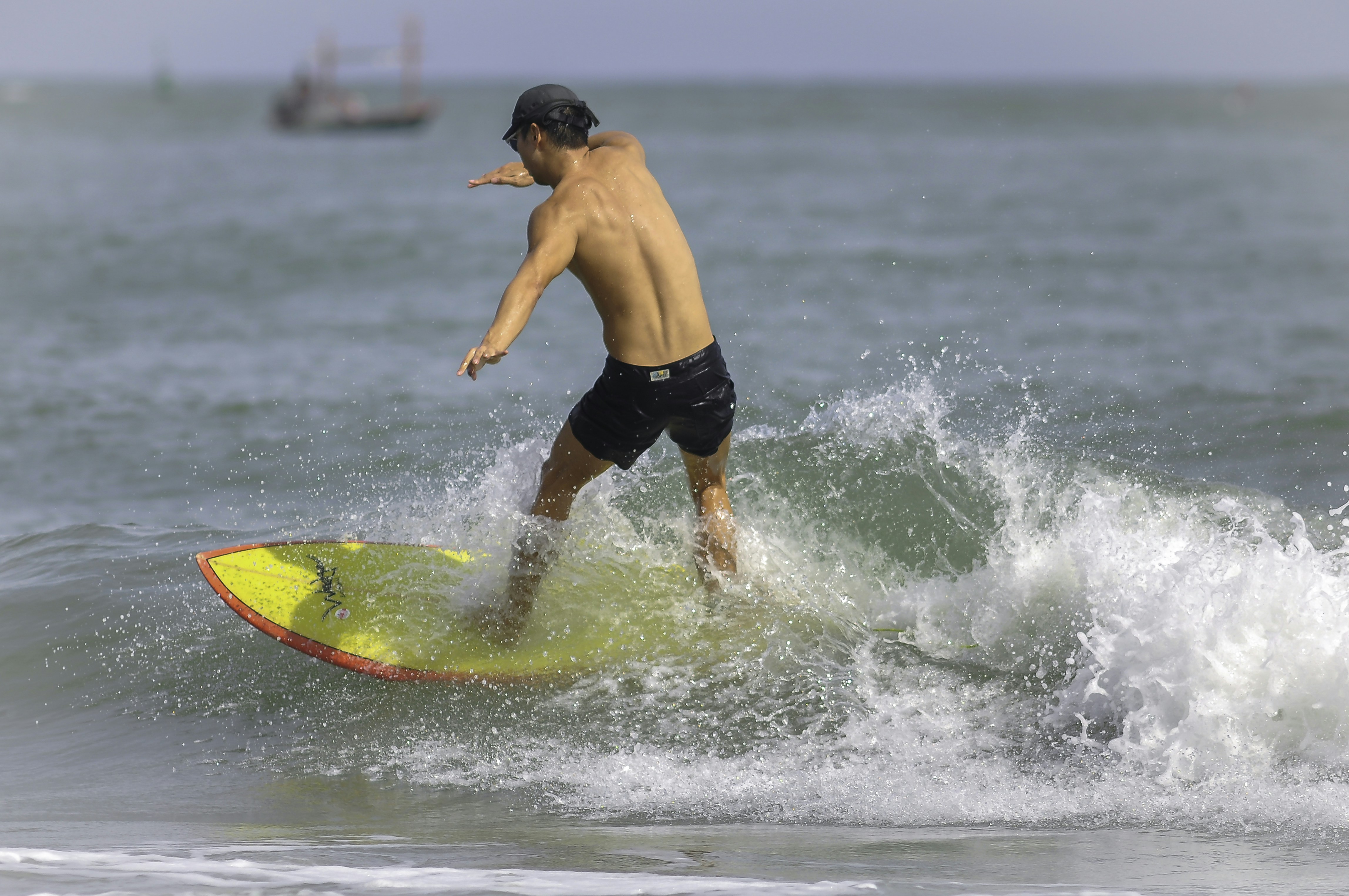 A man riding a wave on top of a surfboard photo – Free Surfing Image on ...