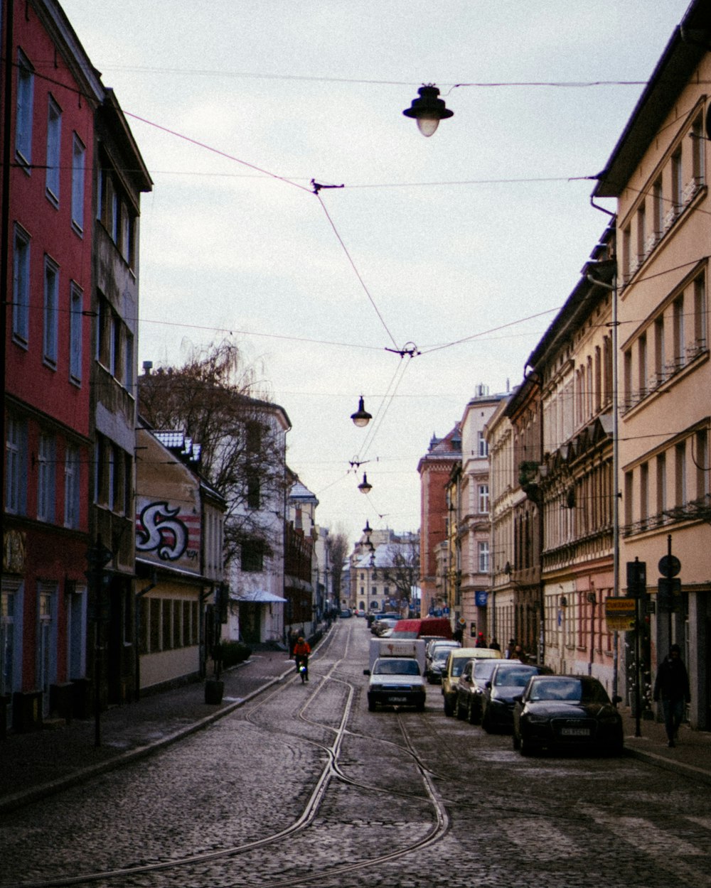 a street with cars parked on both sides of it