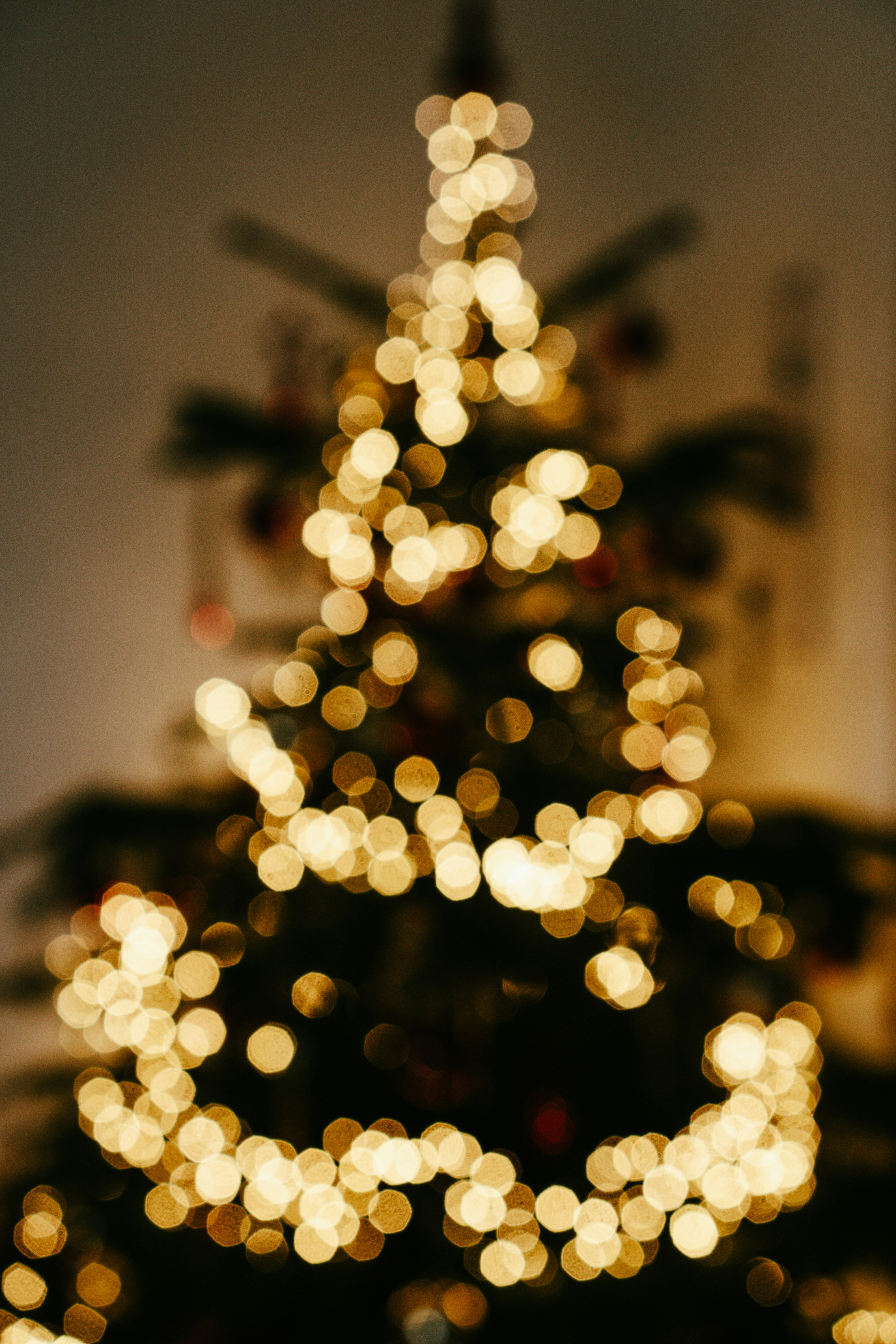 a lit up christmas tree in a living room