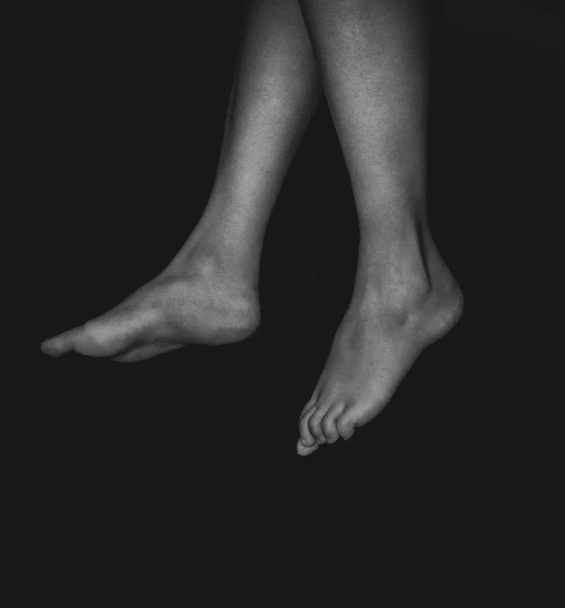 Bare feet before her pedicure appointment