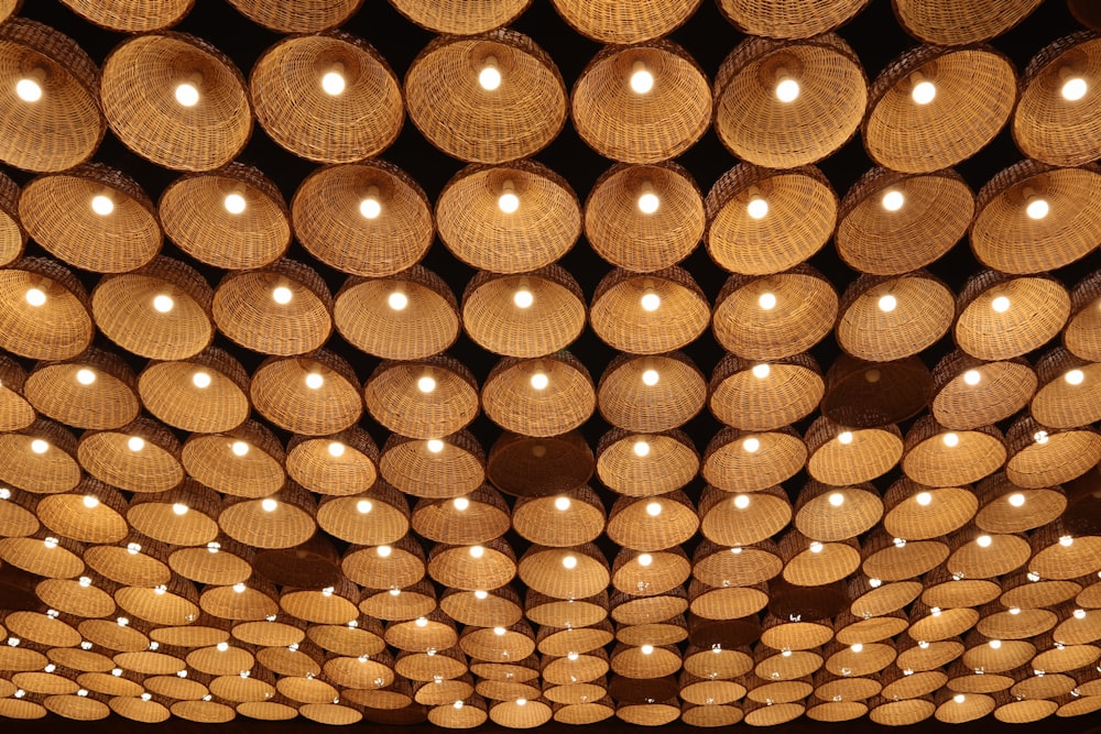 a ceiling made out of baskets and lights