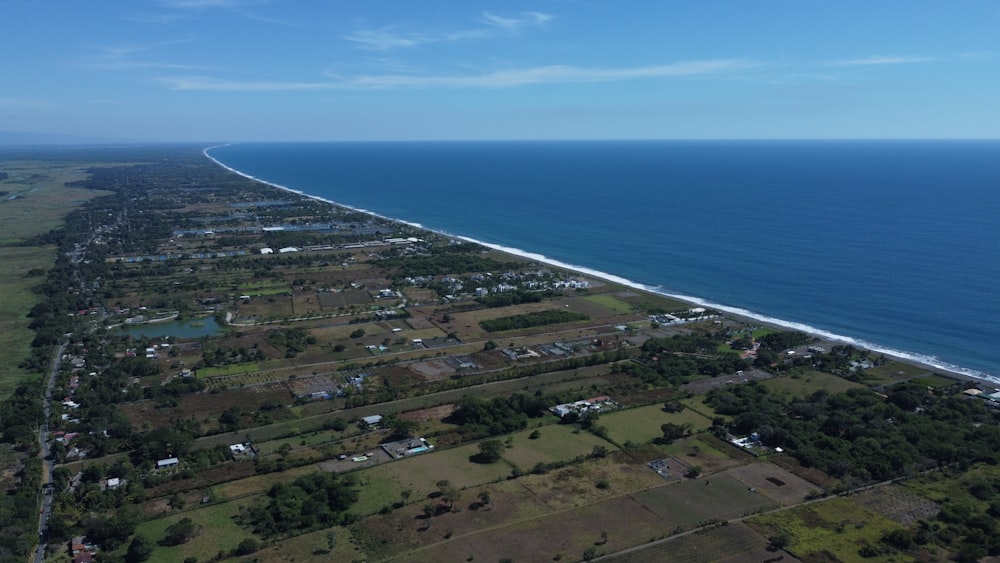 an aerial view of a beach and ocean