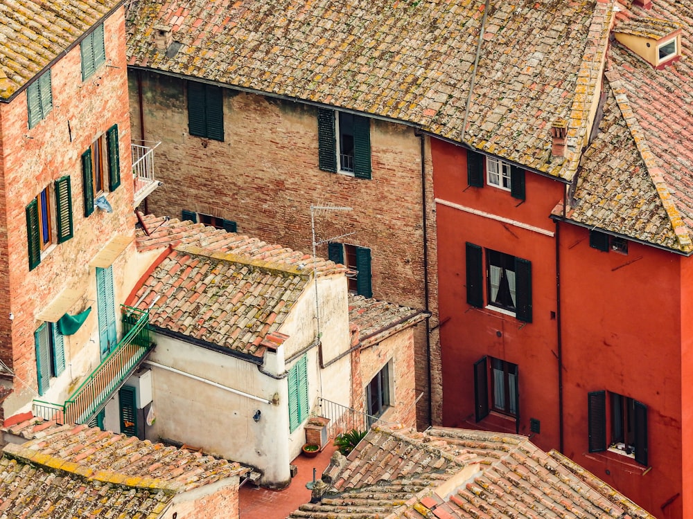 an aerial view of rooftops and buildings in a city