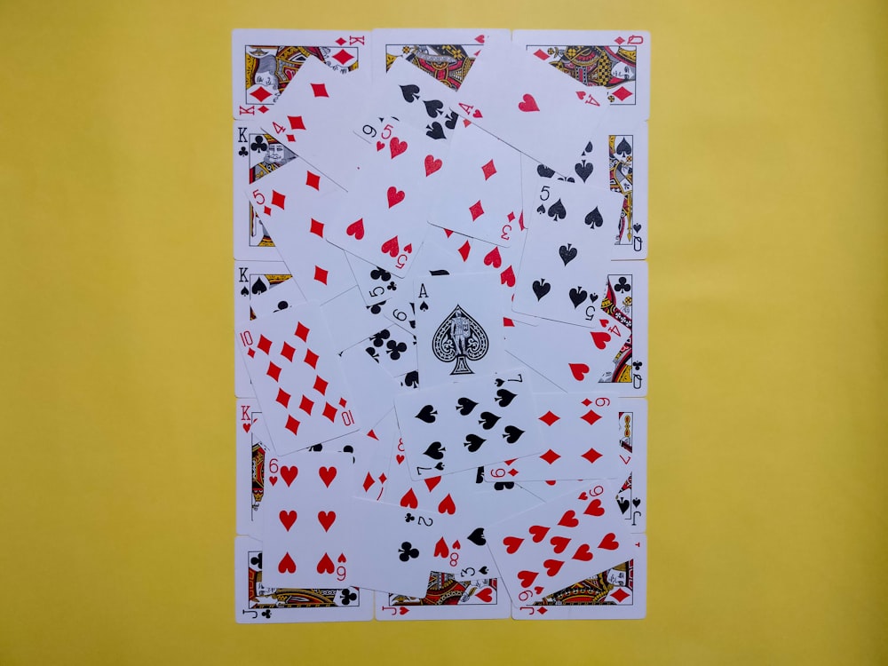 a deck of playing cards on a yellow background