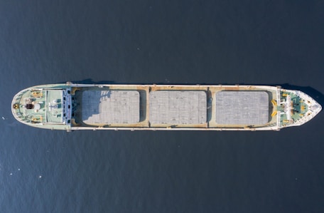 an aerial view of a boat in the water