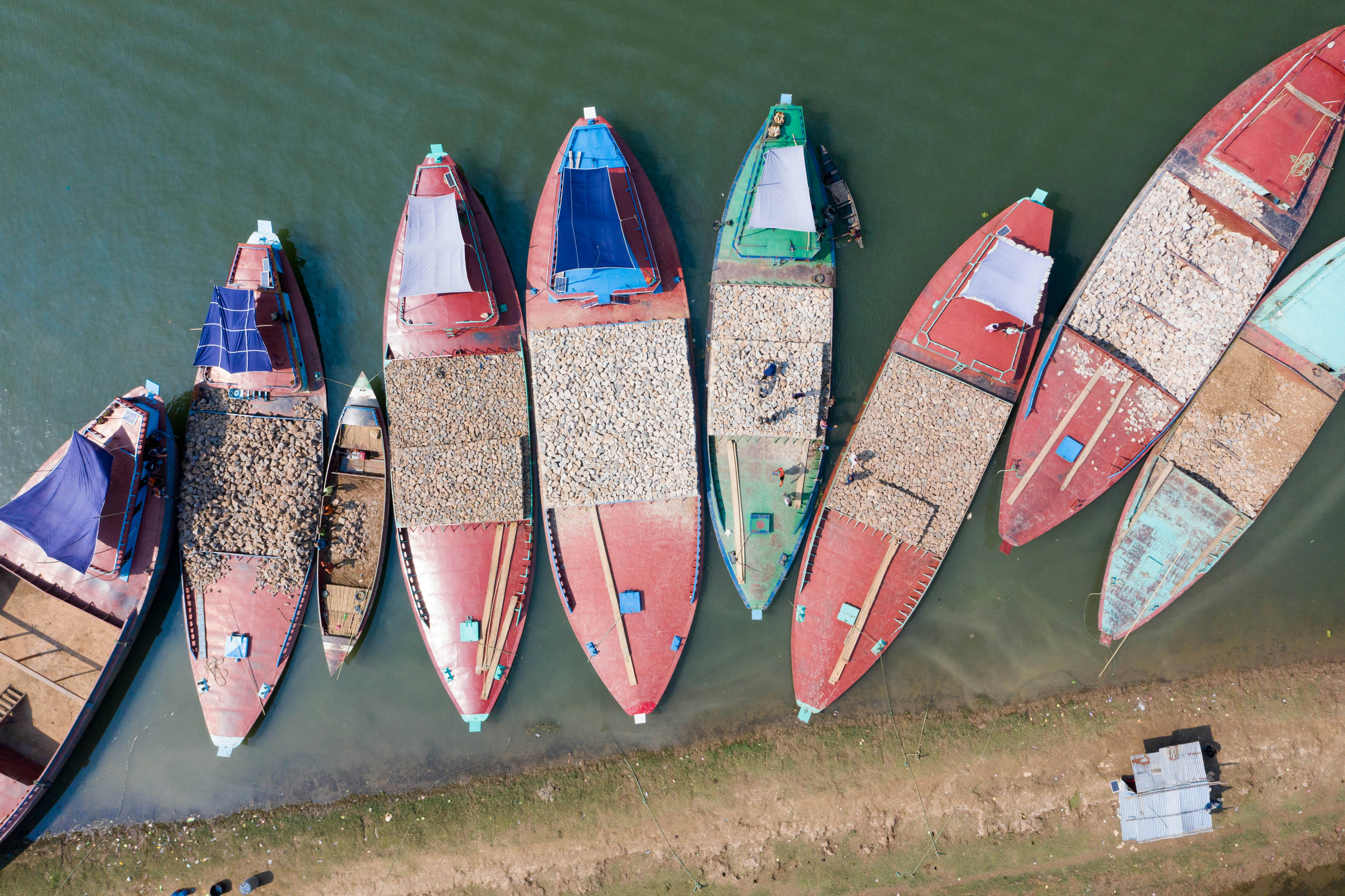 a number of small boats in a body of water