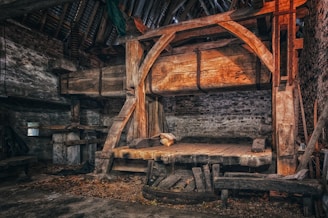 an old wooden bed in a rustic cabin