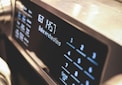 a close up of a microwave with buttons and numbers