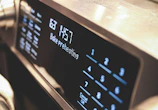 a close up of a microwave with buttons and numbers