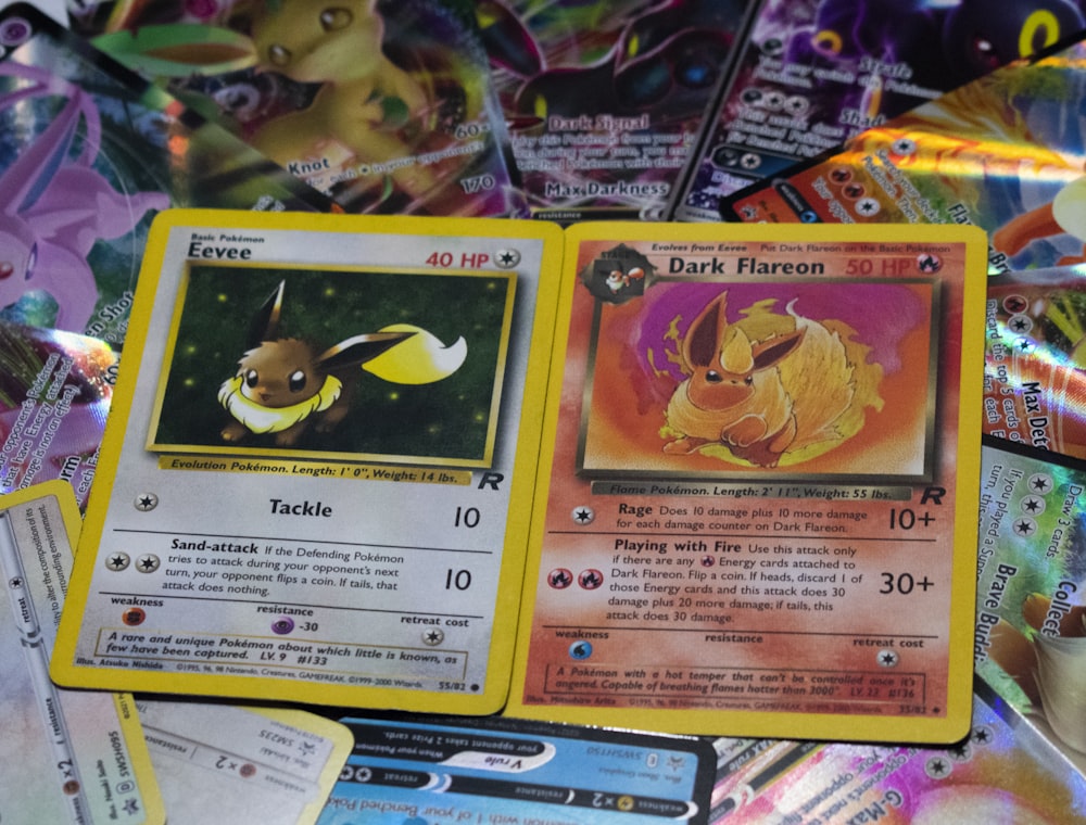 a pile of pokemon cards sitting on top of a table