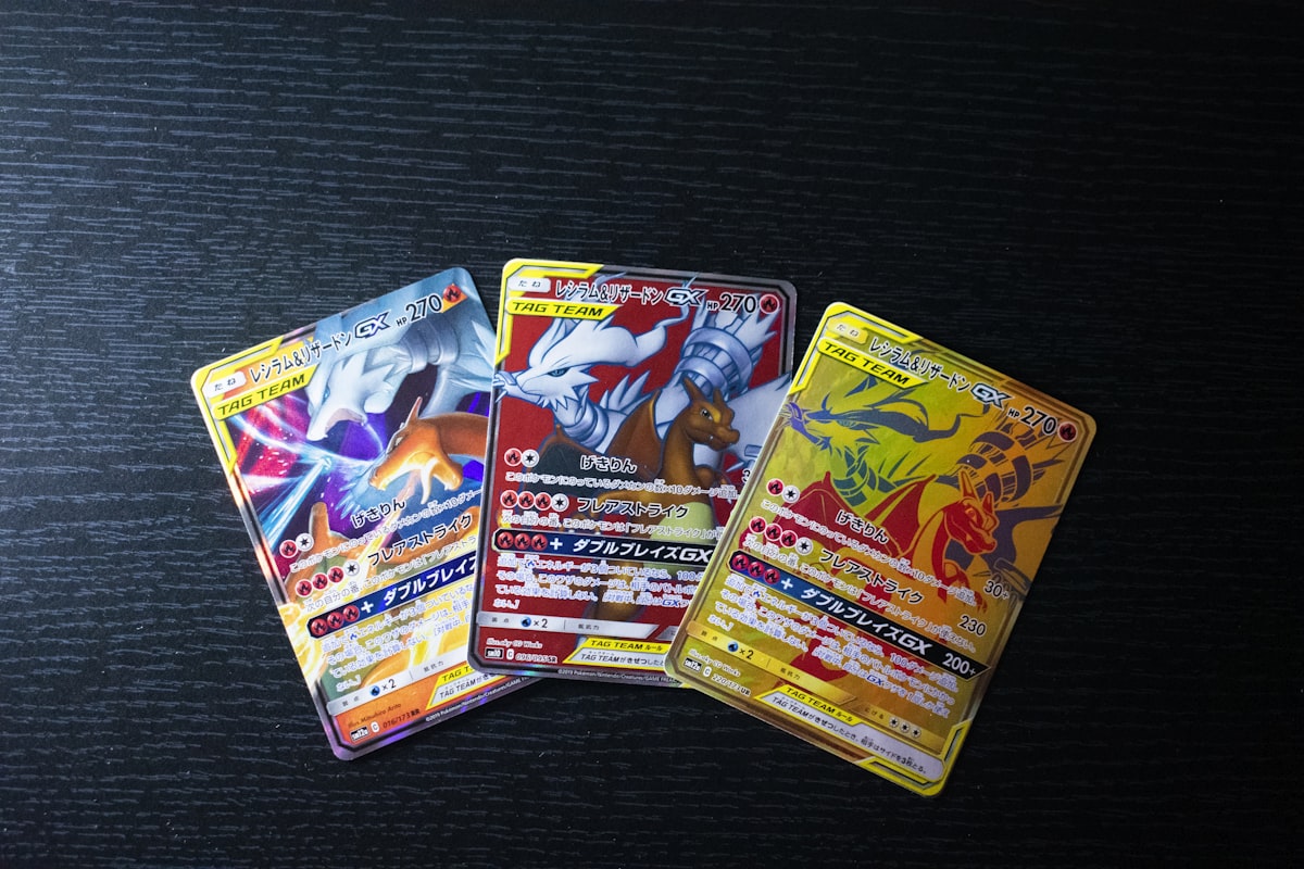 Organized Pokemon TCG collection laid out across collector workspace showing the curation phase of hobby maturity