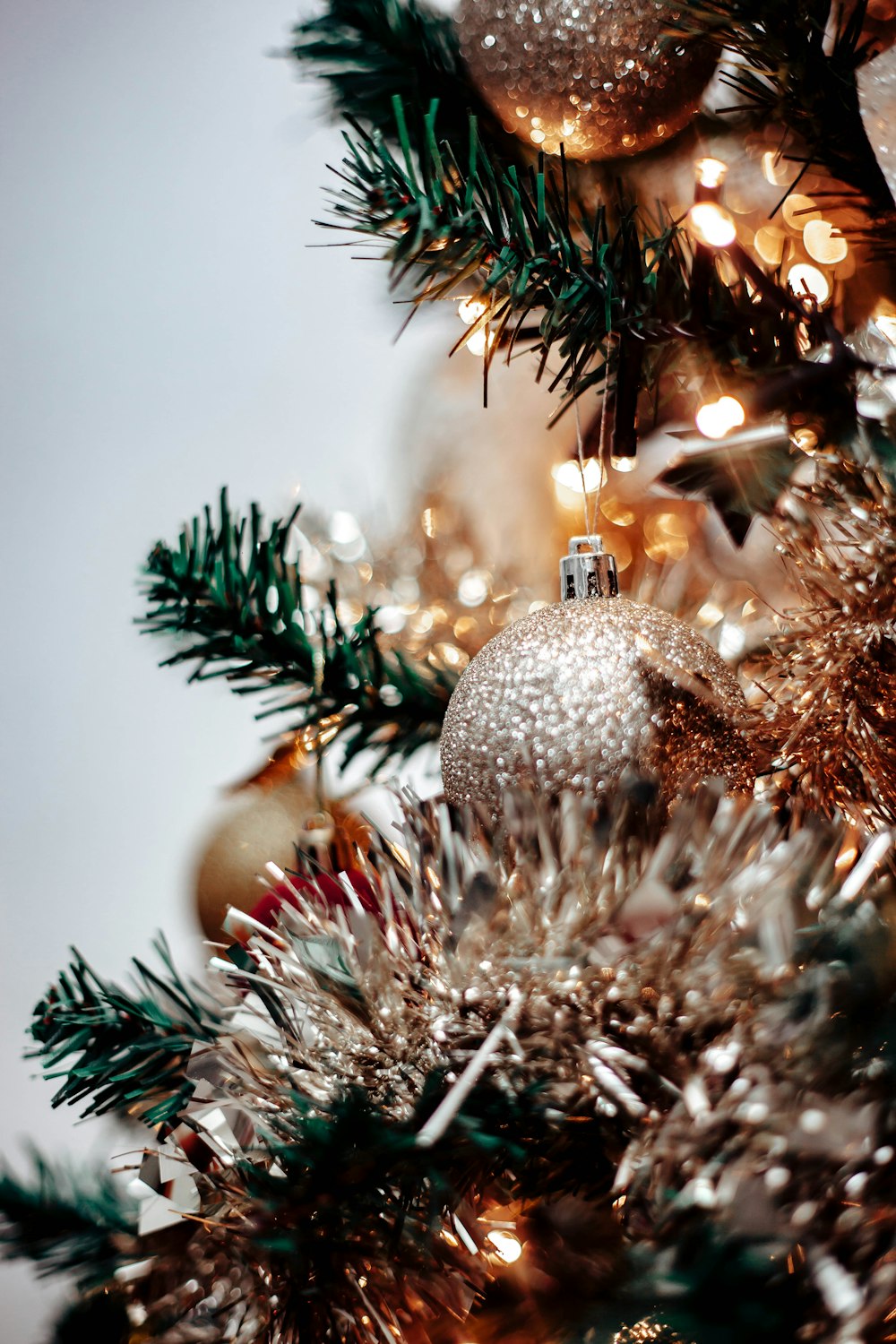 a close up of a christmas tree with ornaments