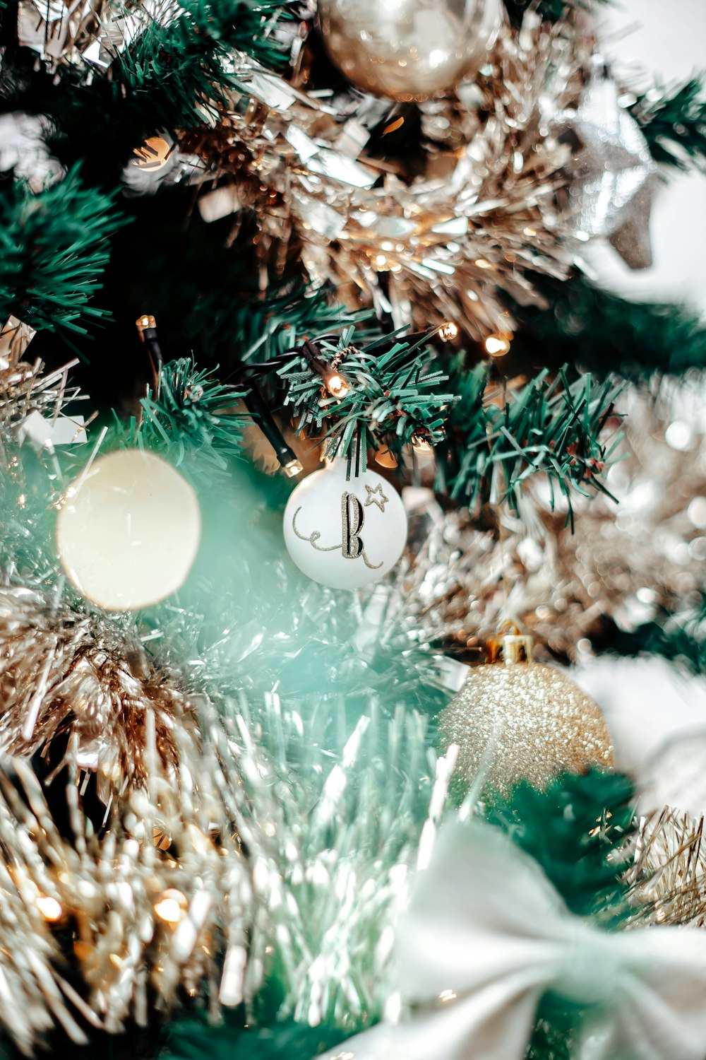 a close up of a christmas tree with ornaments