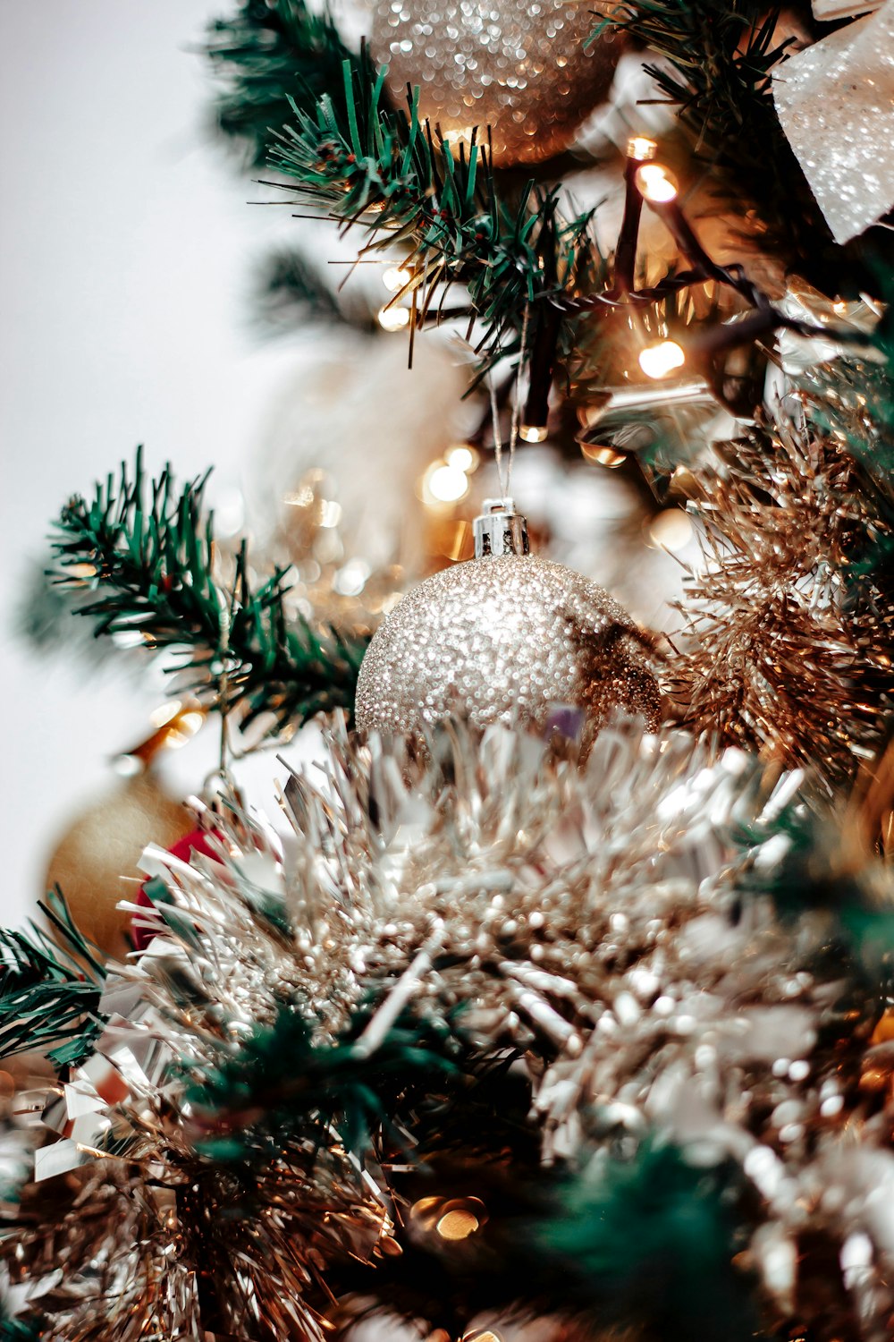 a close up of a christmas tree with ornaments