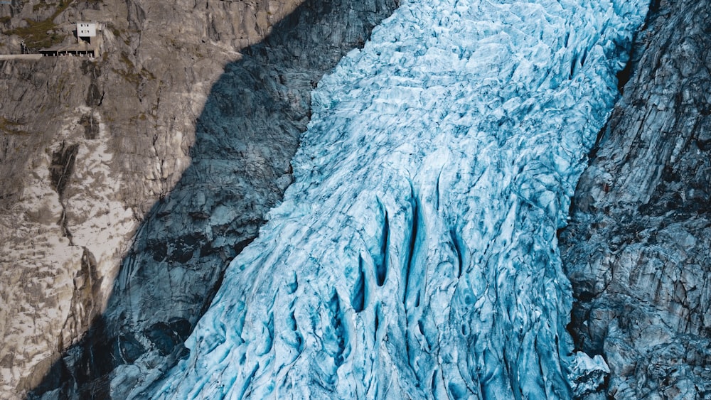 an aerial view of a glacier in the mountains