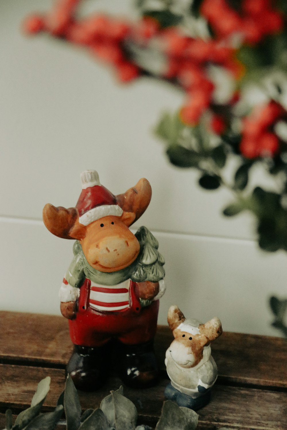 a couple of figurines sitting on top of a wooden table