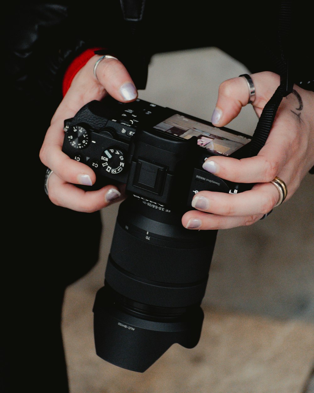 a woman holding a camera in her hands