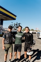 A group of happy local drivers posing with their new Canvolt electric tricycles under a bright African sky.