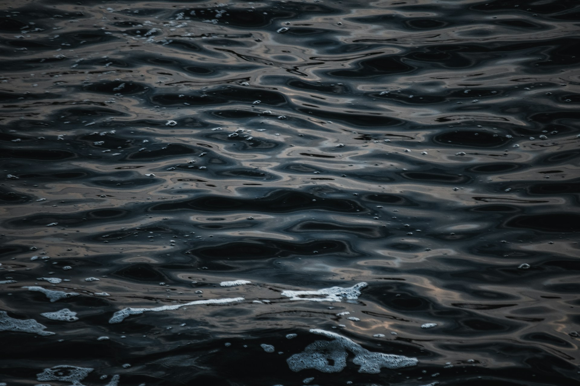 a body of water that has some water bubbles on it