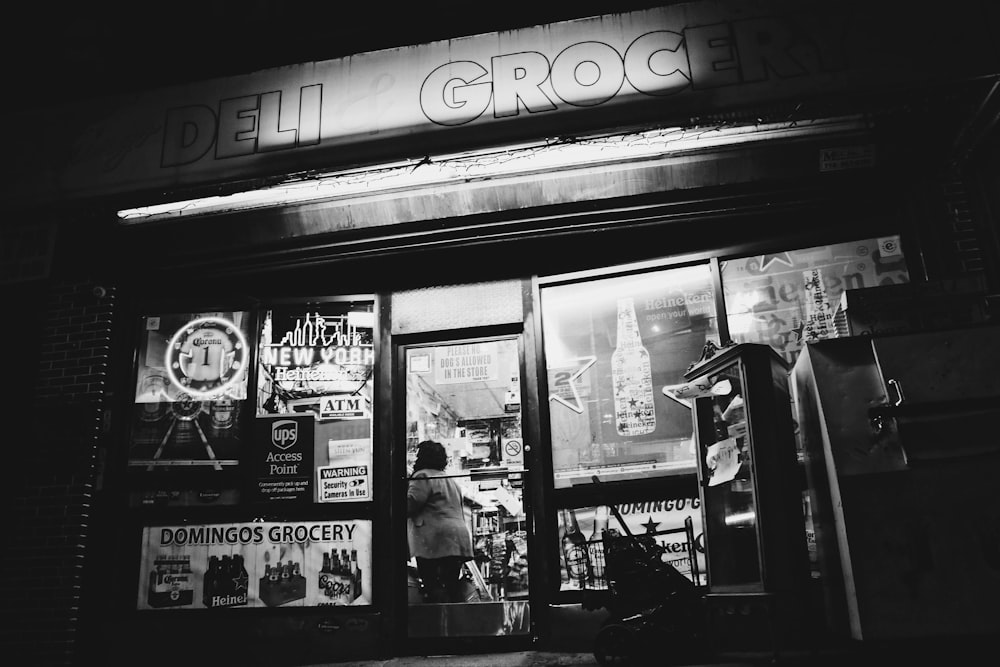 a black and white photo of a store front