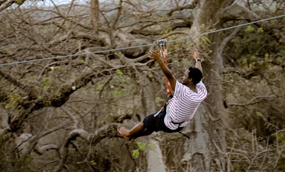 a man on a rope high up in the air