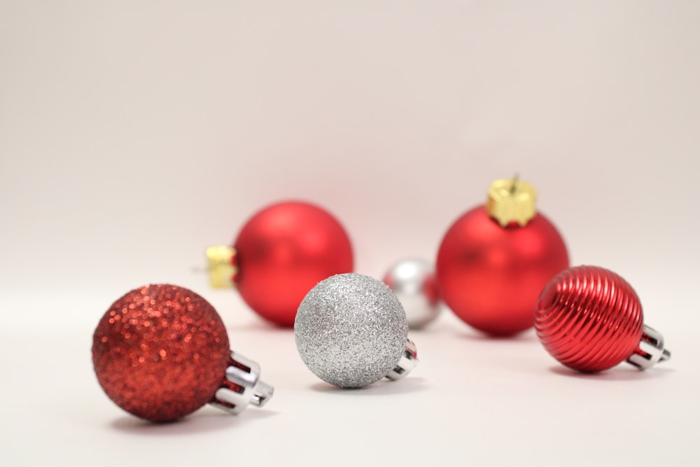 a group of red and silver christmas ornaments