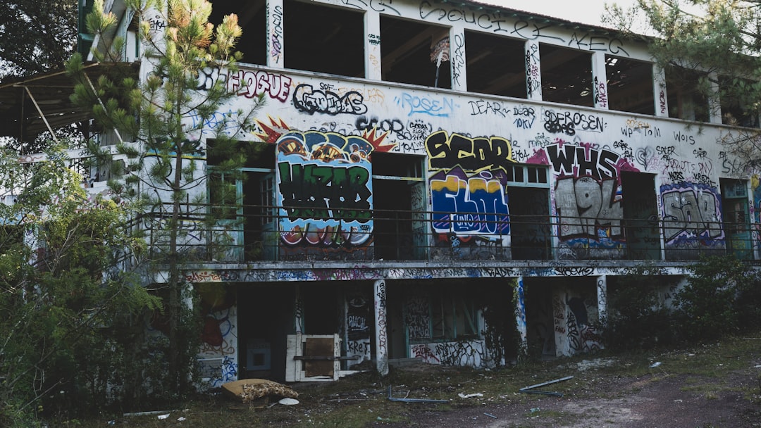 a run down building with graffiti all over it,