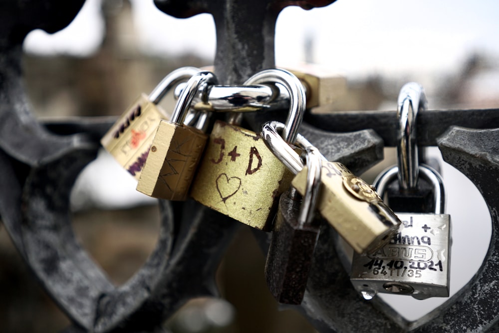 a couple of padlocks attached to a gate