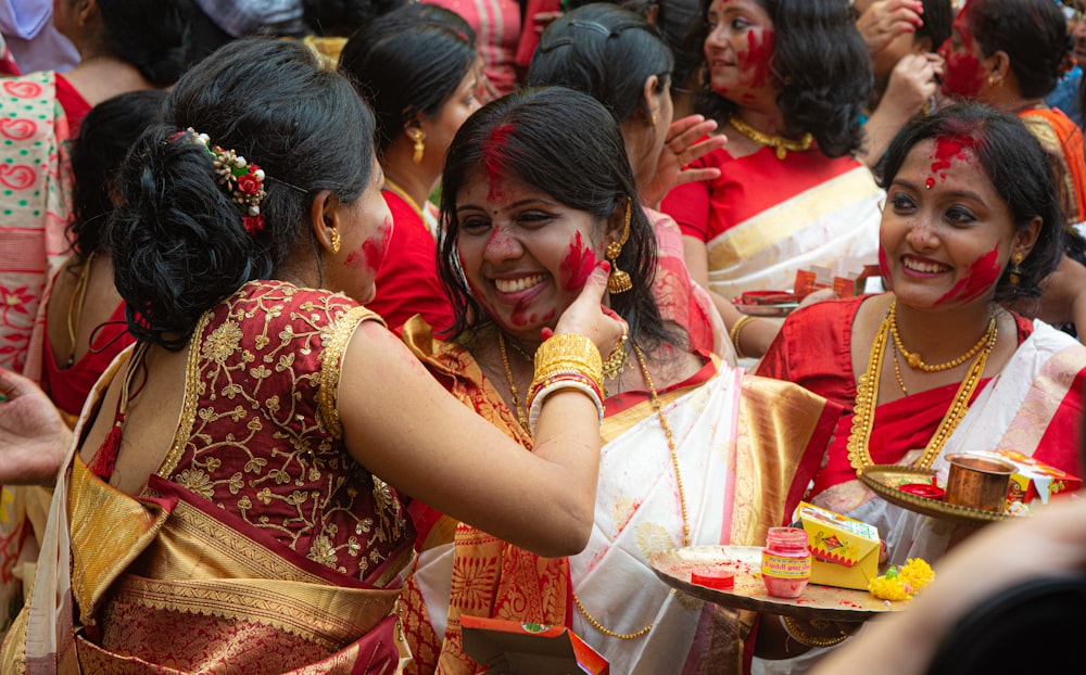 a group of women standing next to each other