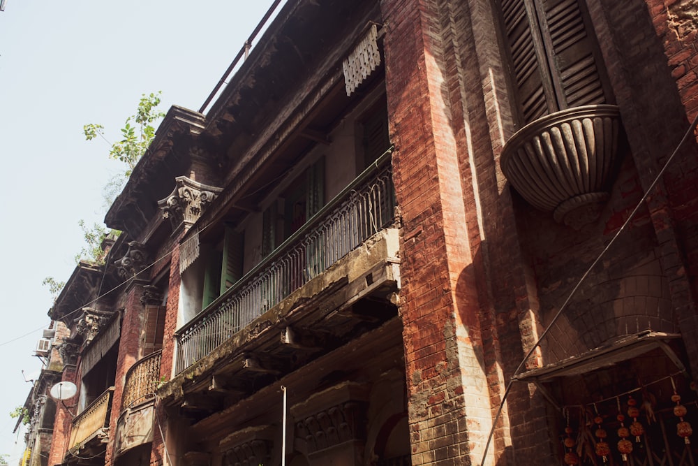 a tall brick building with balconies and balconies