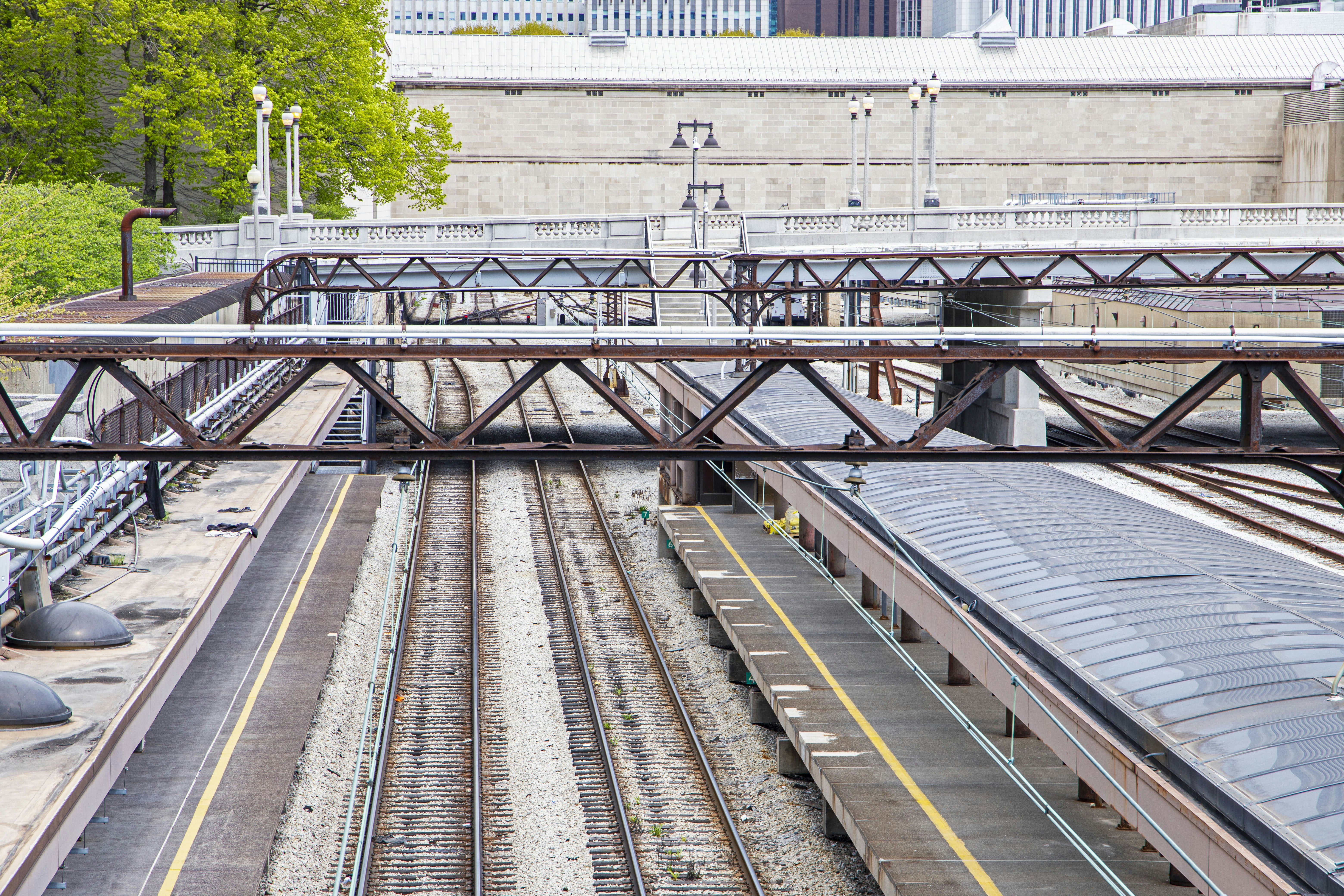 Station platforms and tracks seen from an overhead walkway
